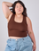 Ashley is 5'7" and wearing L Cropped Tank Top in Fudgesicle Brown