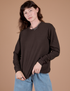 Alex is 5’8” and wearing P Long Sleeve Burly Tee in Espresso Brown