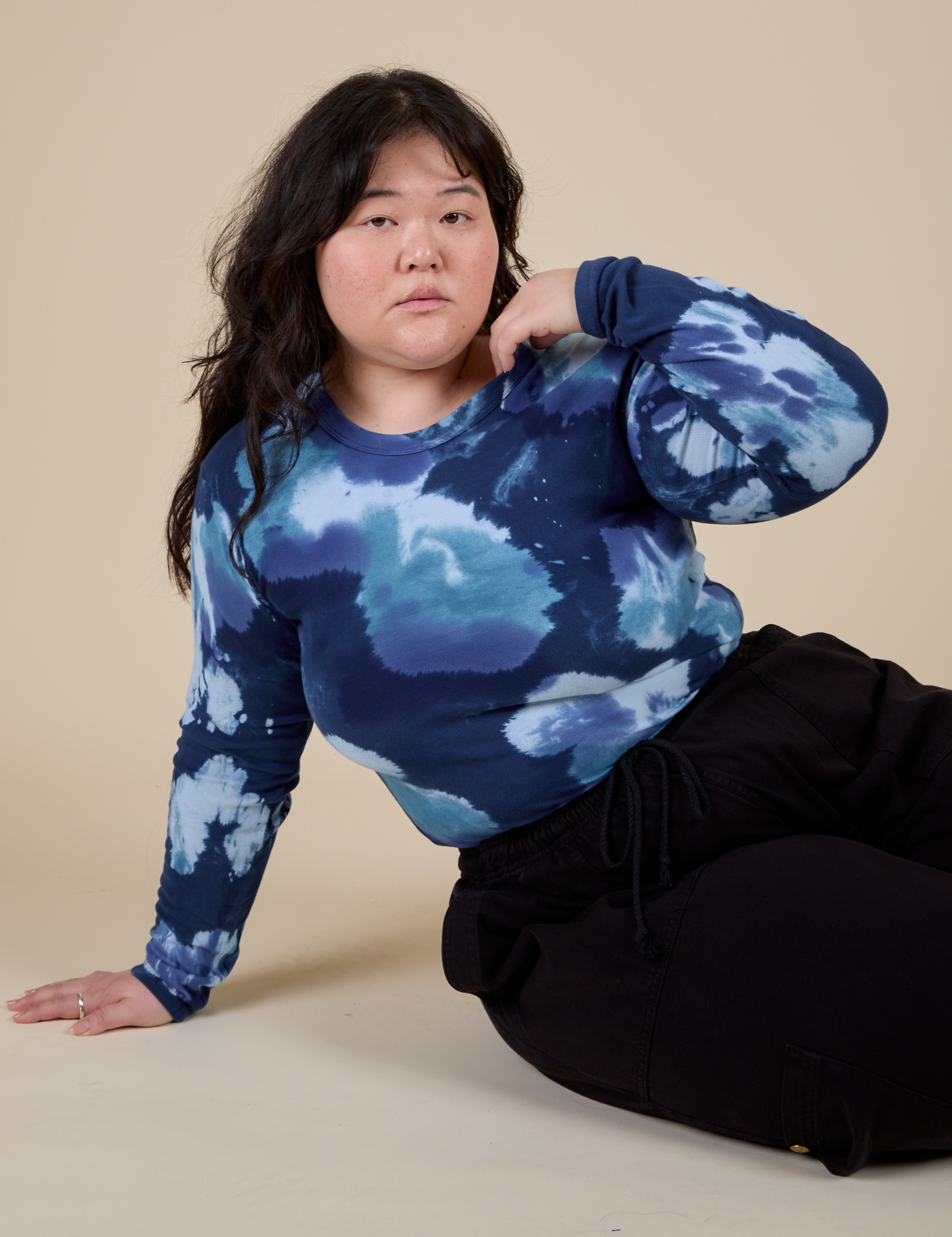 Ashley is wearing Long Sleeve Baby Tee in Blue Magic Waters