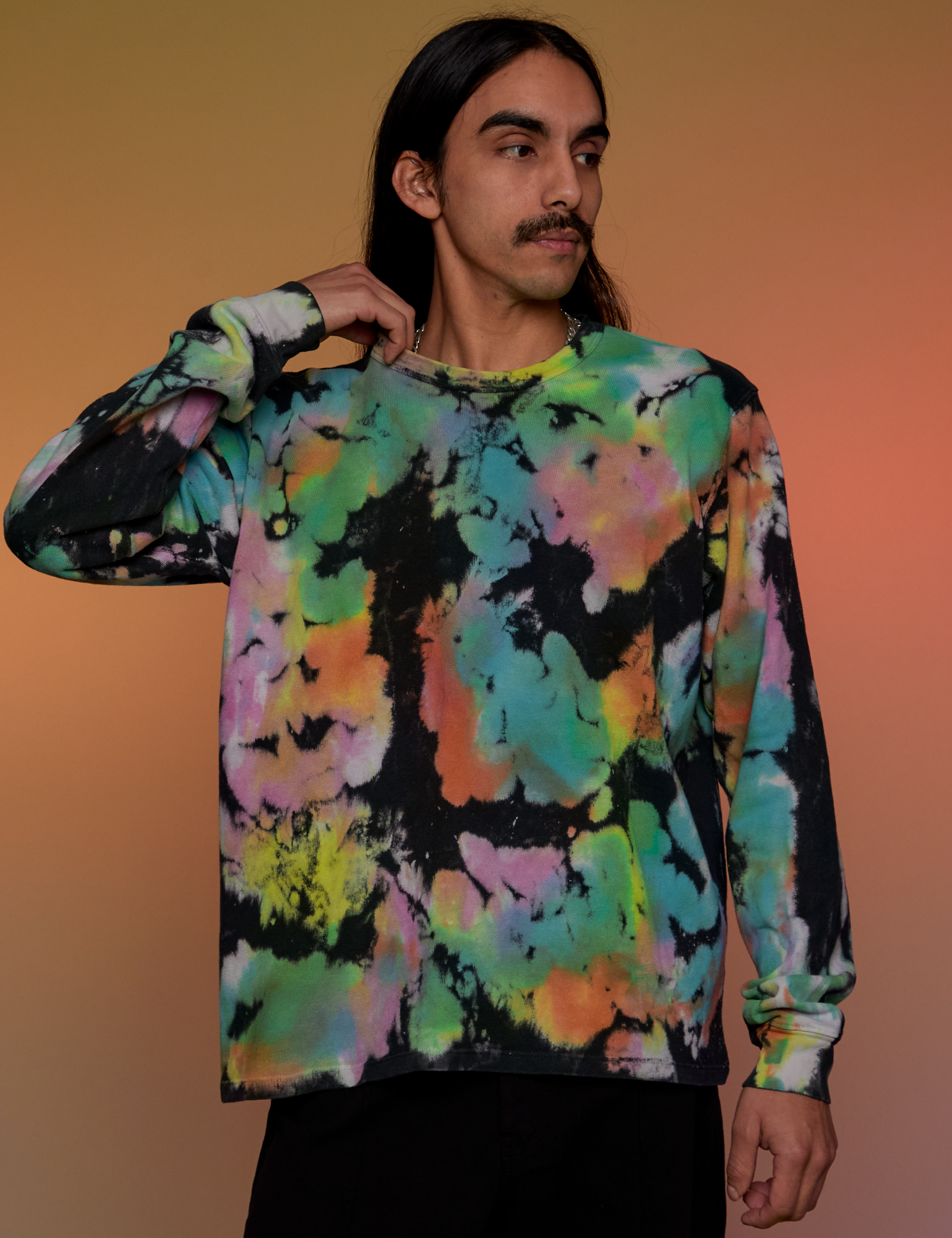 Anthony is 5’6” and wearing S Magic Waters Long Sleeve Burly Tee in Rainbow