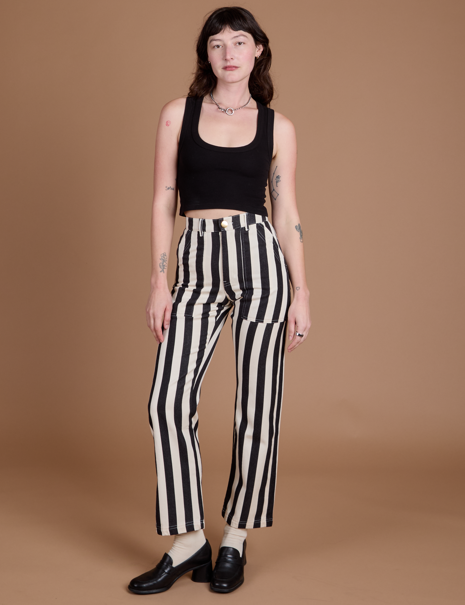 Alex is 5’8” and wearing XXS Black Stripe Work Pants in White