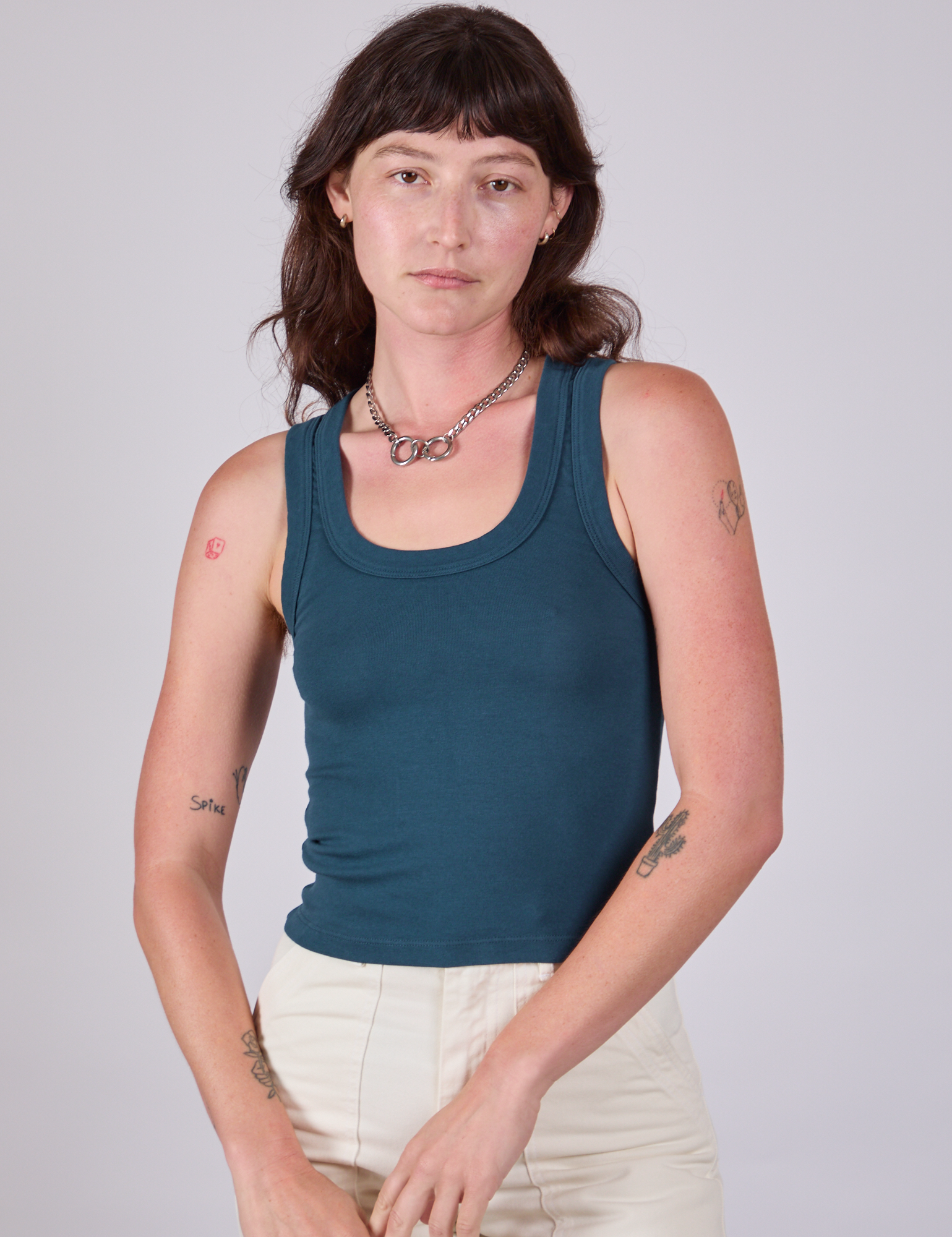 Alex is 5'8" and wearing P Tank Top in Lagoon