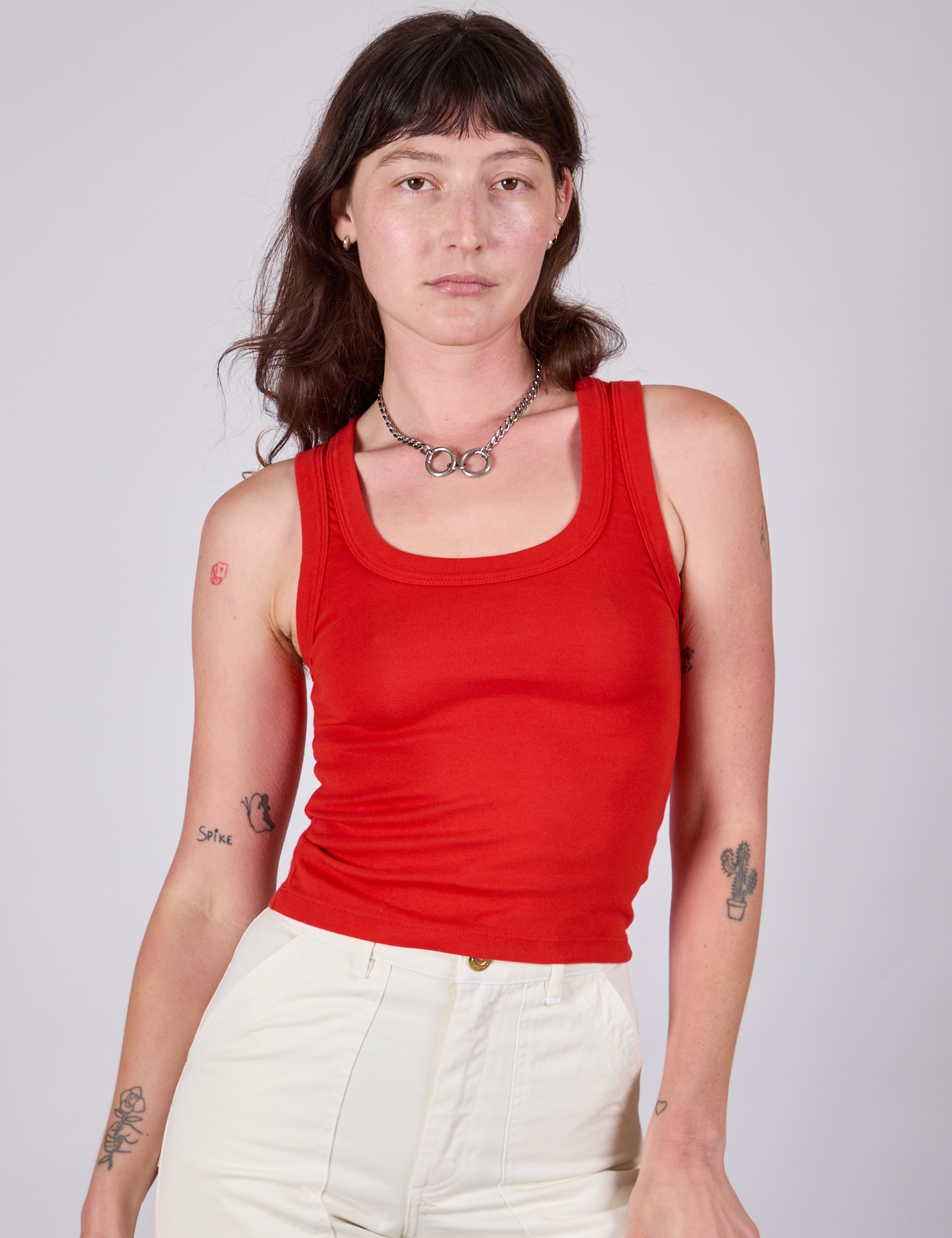 Alex is 5'8" and wearing P Tank Top in Mustang Red