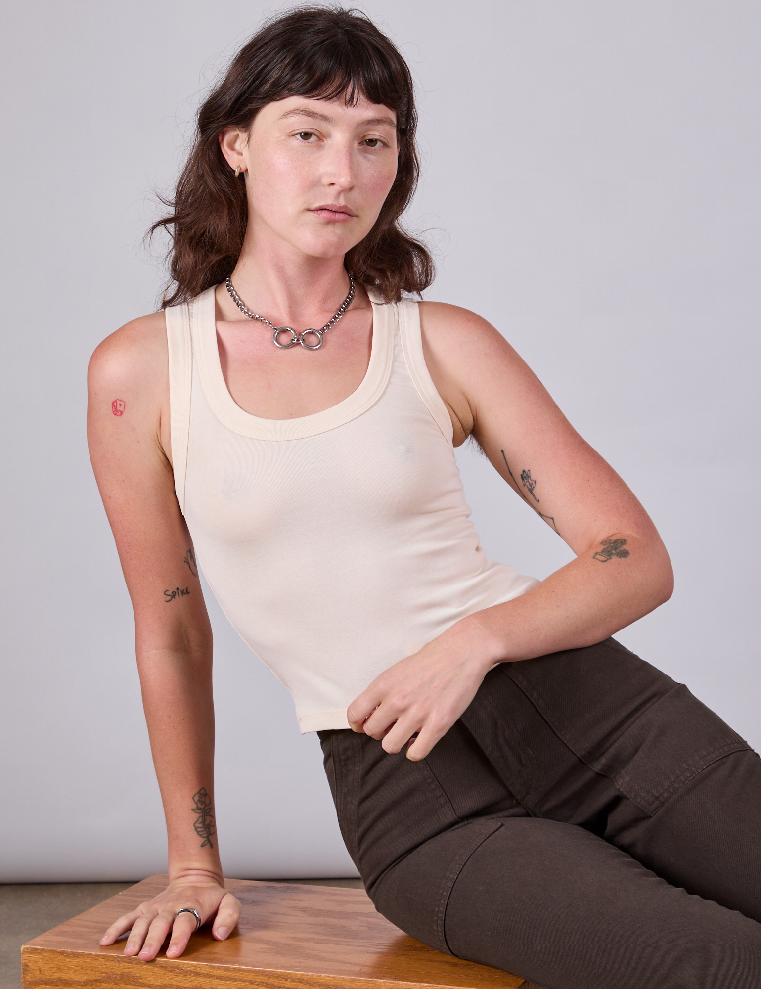 Alex is 5'8" and wearing P Tank Top in Vintage Tee Off-White