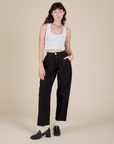 Alex is 5'8" and wearing XXS Heavyweight Trousers in Basic Black paired with a vintage tee white Cropped Tank