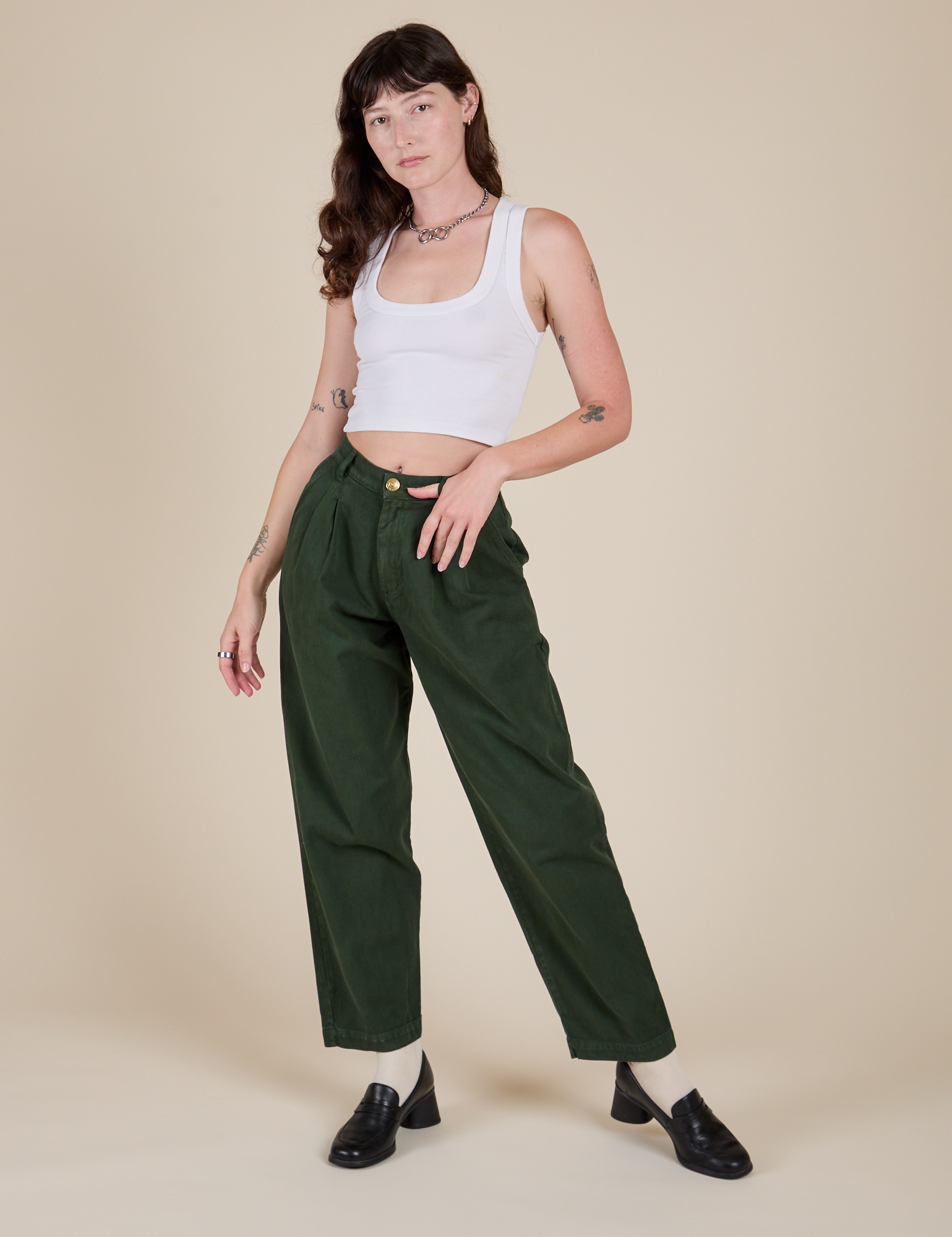 Alex is 5'8" and wearing XXS Heavyweight Trousers in Swamp Green paired with a Cropped Tank in Vintage Tee White
