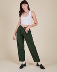 Alex is 5'8" and wearing XXS Heavyweight Trousers in Swamp Green paired with a Cropped Tank in Vintage Tee White