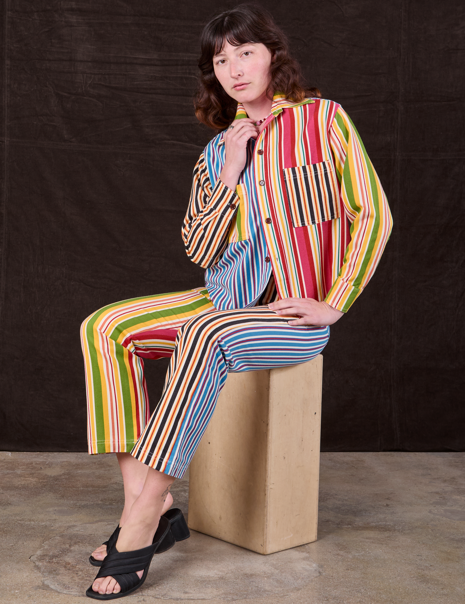 Alex is wearing Mixed Stripe Work Pants paired with matching Cropped Overshirt