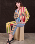 Alex is wearing Mixed Stripe Work Pants paired with matching Cropped Overshirt