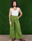 Jesse is 5'8" and wearing XXS Overdyed Wide Leg Trousers in Gross Green paired with vintage off-white Cropped Tank Top