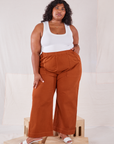 Morgan is 5'5" and wearing 2XL Action Pants in Burnt Terracotta and Cropped Tank Top in vintage tee off-white