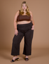Juliet is 5’7” and wearing 1XL Action Pants in Espresso Brown paired with fudgesicle brown Mini Tank