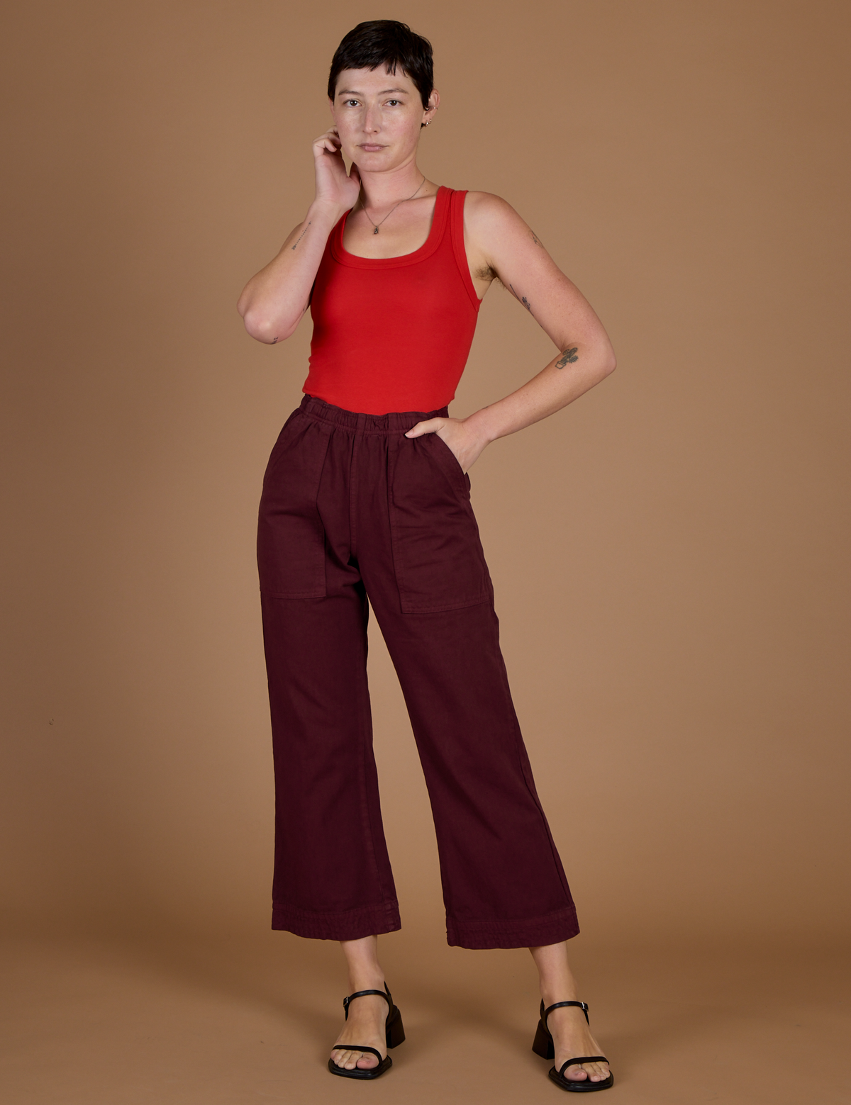 Alex is 5’8” and wearing XXS Red Wine Action Pant with the Mustang Tank Top