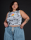 Kristen is 5’9” and wearing L Dark Cloud Airbrush Muscle Tee