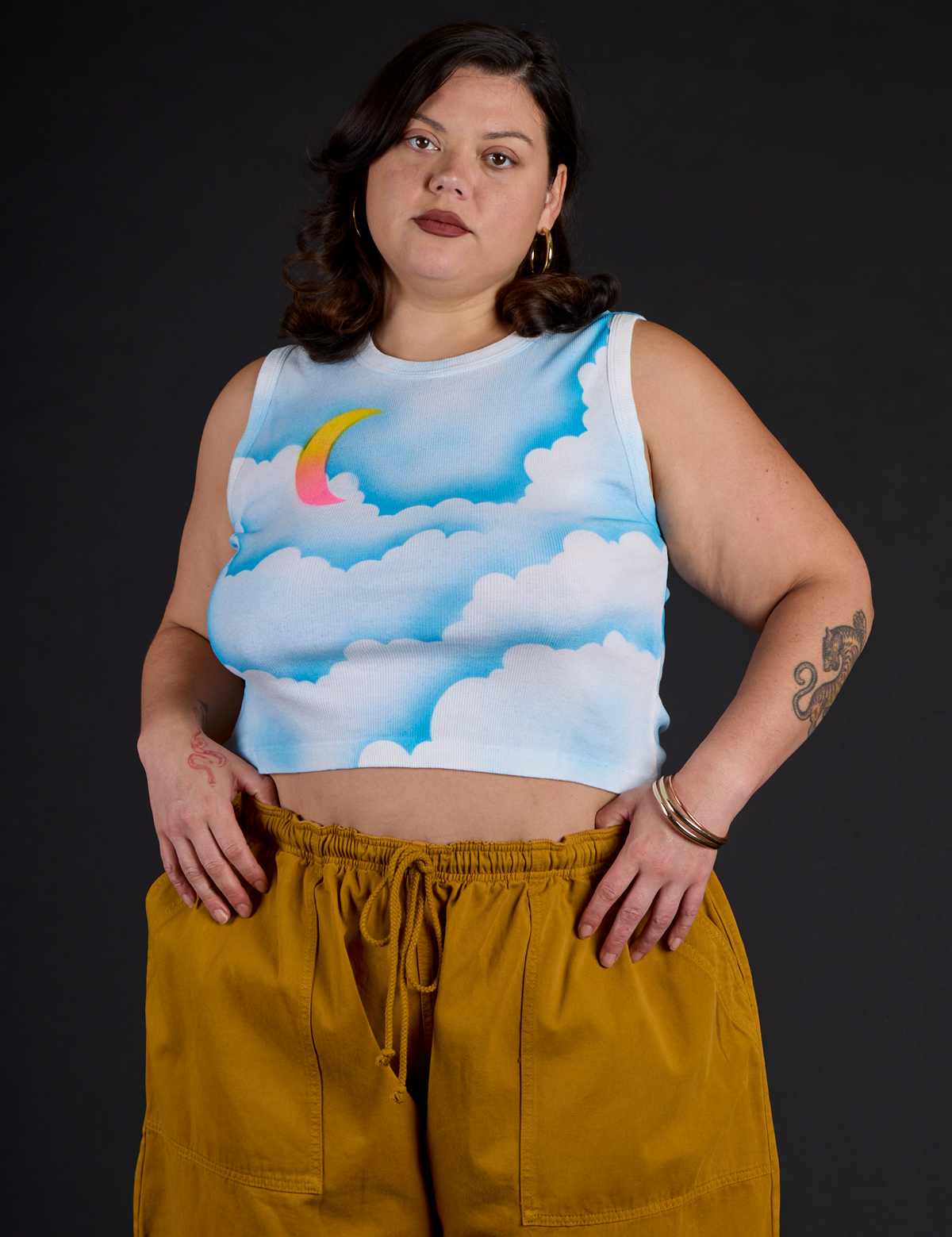 Kristen is 5’9” and wearing L Morning Moon Airbrush Muscle Tee