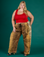 Juliet is 5'7" and wearing 2XL Leopard Drop Pocket Pant with the Mustang Red Cropped Tank