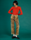 Kira is 5’10" and wearing XS Leopard Work Pants with Chili Red Long Sleeve Baby Tee