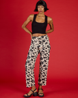 Kira wearing the Cow Work Pant with the Black Cropped Tank