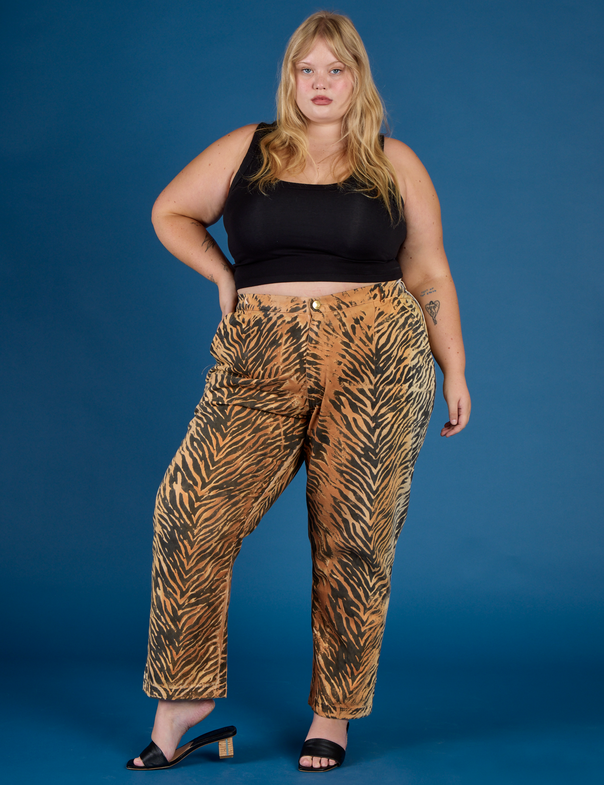 Juliet is 5'7" and wearing 2XL Tiger Work Pant with the Black Cropped Tank