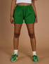 Kandia is wearing Athletic Shorts in Forest Green