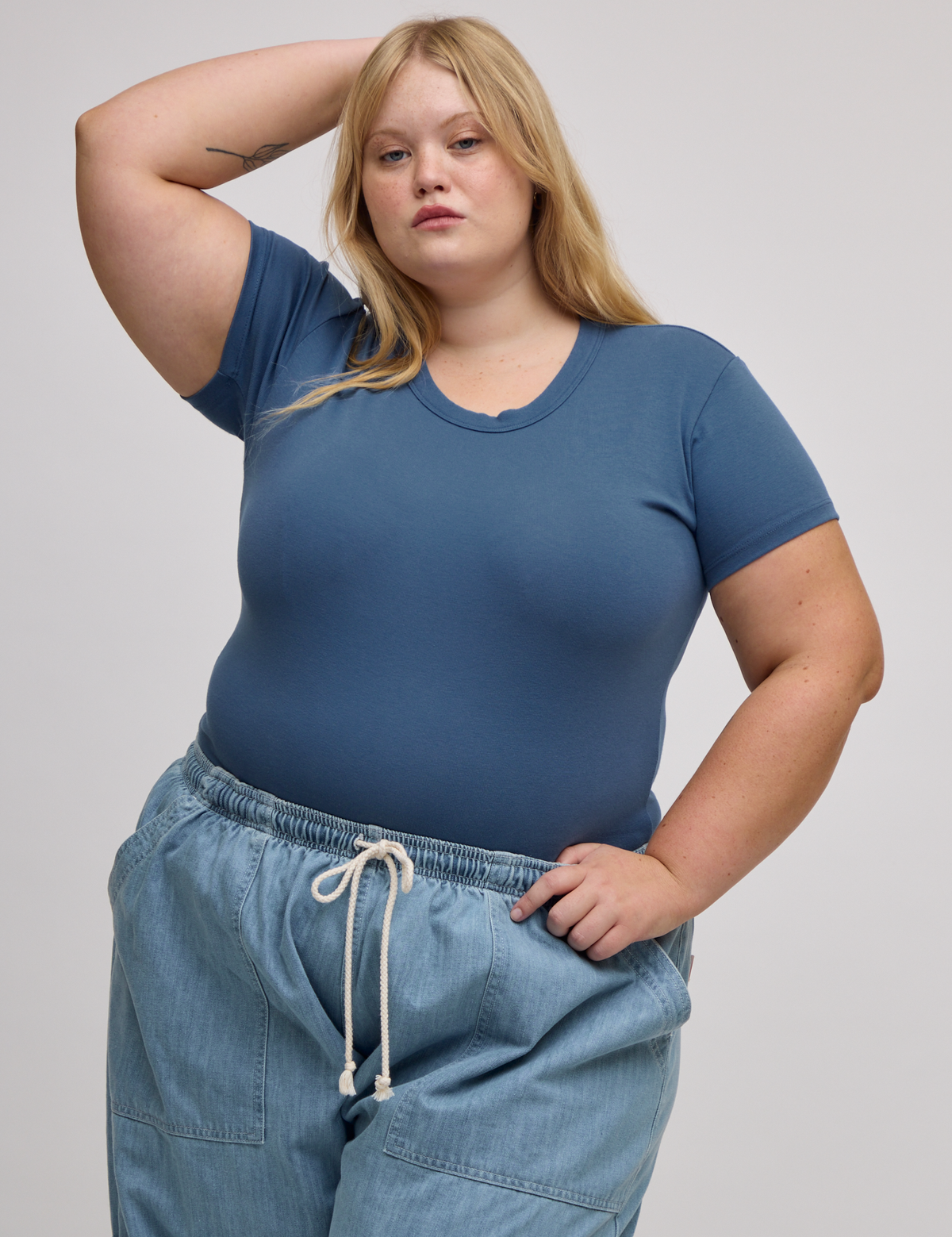 Juliet is 5'7" and wearing L Baby Tee in French Blue