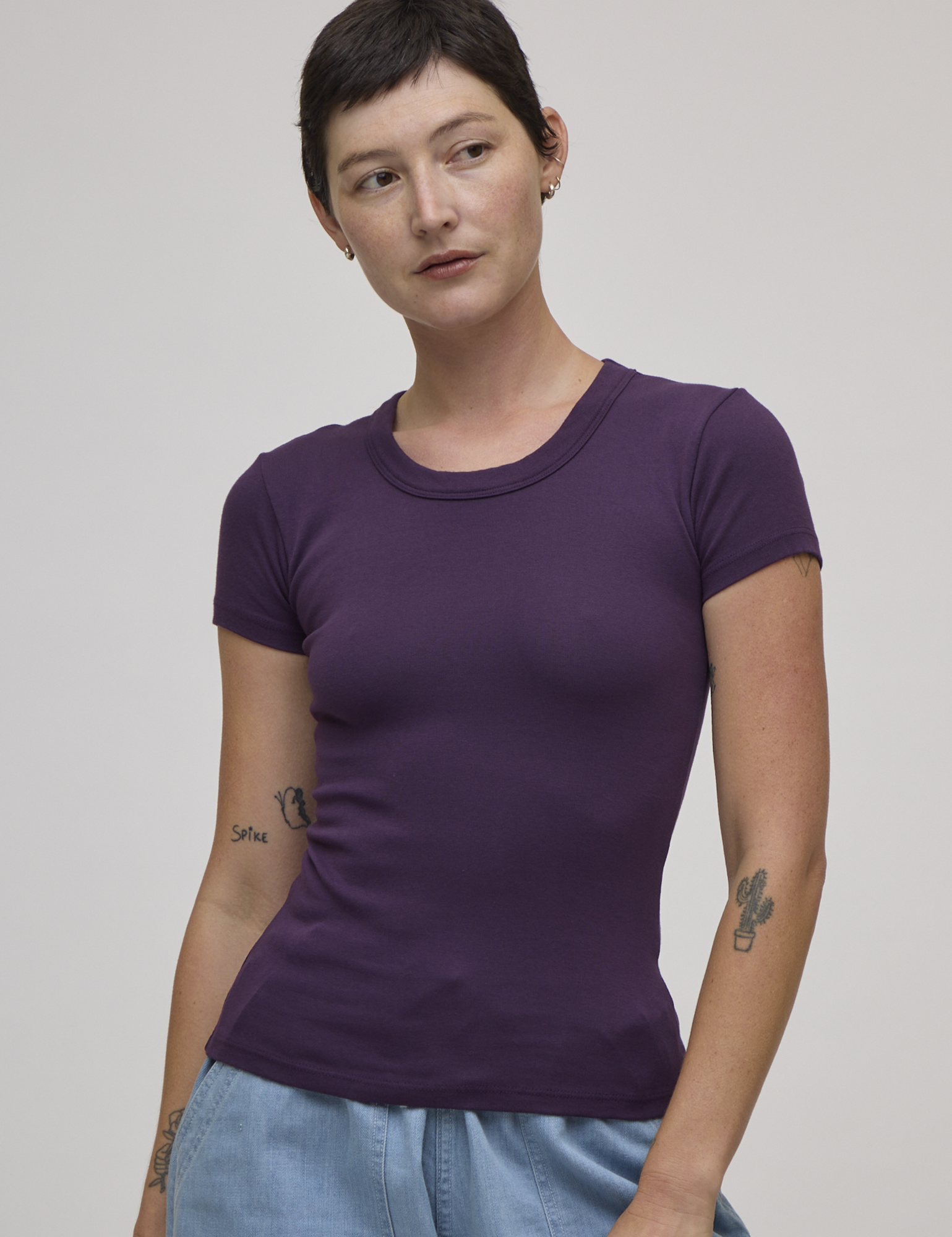 Alex is 5'8" and wearing P Baby Tee in Nebula Purple