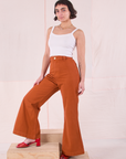 Soraya is 5'3" and wearing P Bell Bottoms in Burnt Terracotta