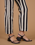 Close up of Black Stripe Work Pants in Natural pant legs on Alex