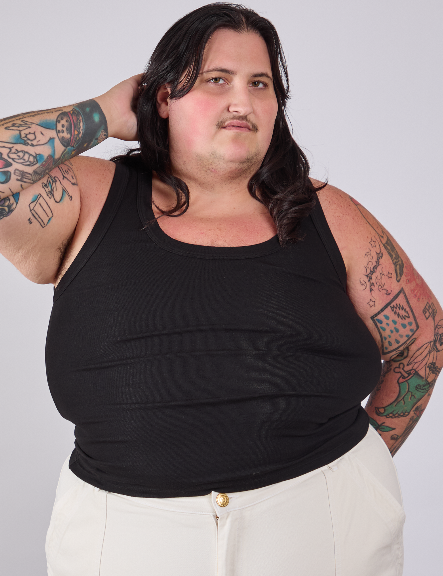 Sam is 5'10" and wearing 1XL Tank Top in Basic Black