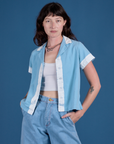 Alex is 5’8” and wearing P Painted Pantry Button-Up in Baby Blue