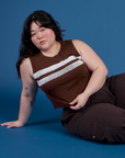 Ashley is 5’7” and wearing L Painted Muscle Tee in Fudgesicle Brown