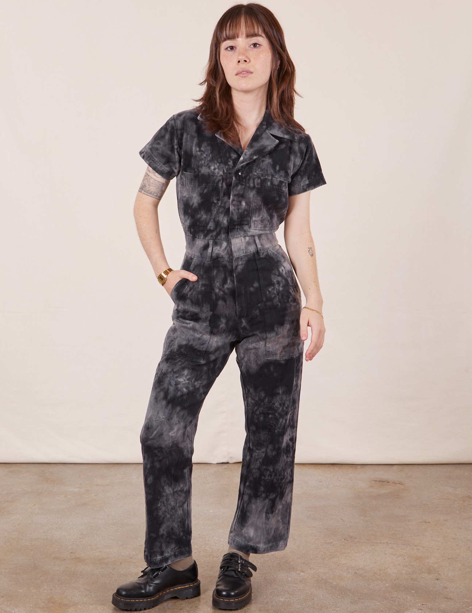 Hana is 5&#39;3&quot; and wearing XXS Petite Petite Short Sleeve Jumpsuit in Black Magic Waters