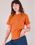 Alex is 5'8" and wearing P Burly Tee in Construction Orange