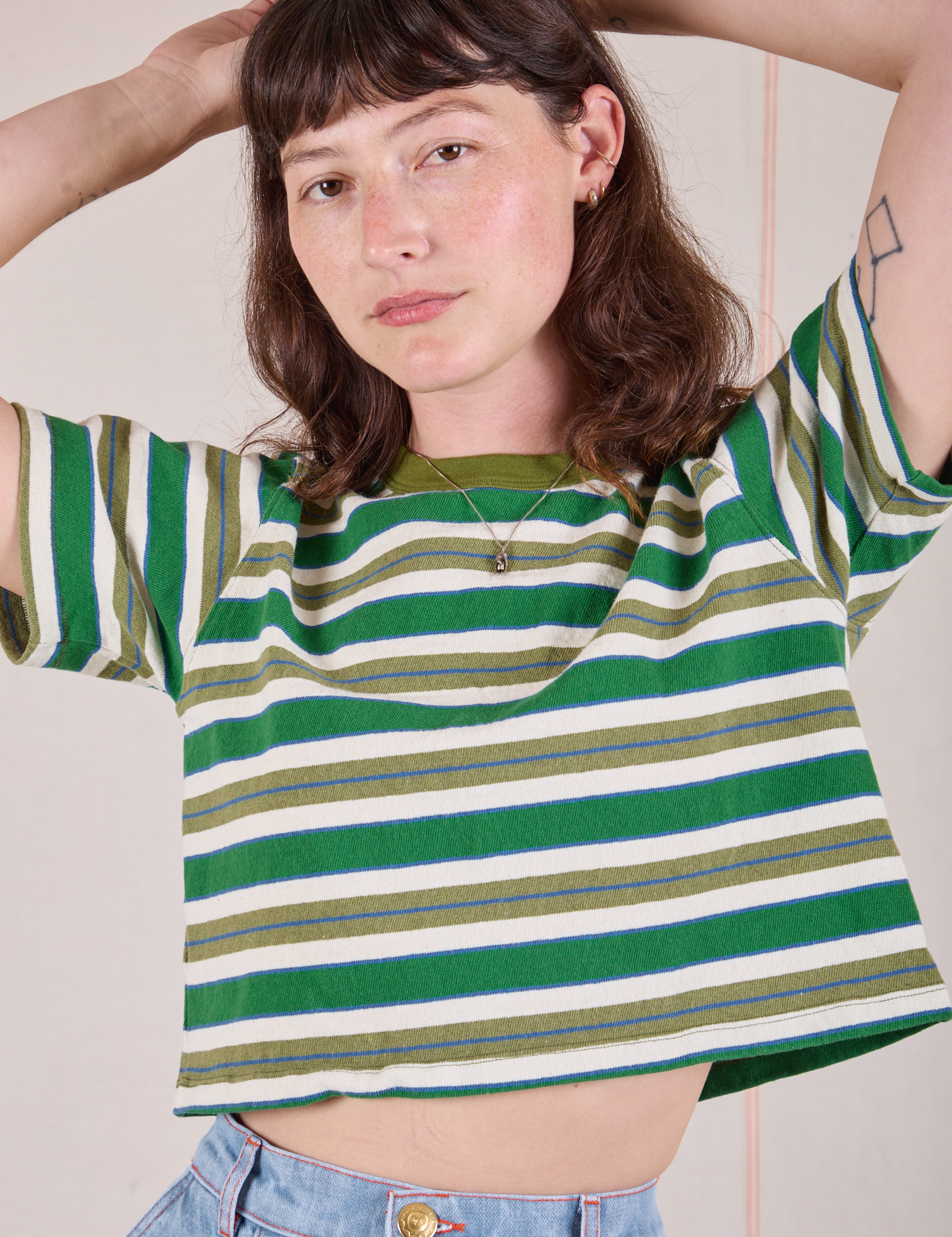Alex is 5'8" and wearing P Striped Crop Burly Tee in Blue & Green