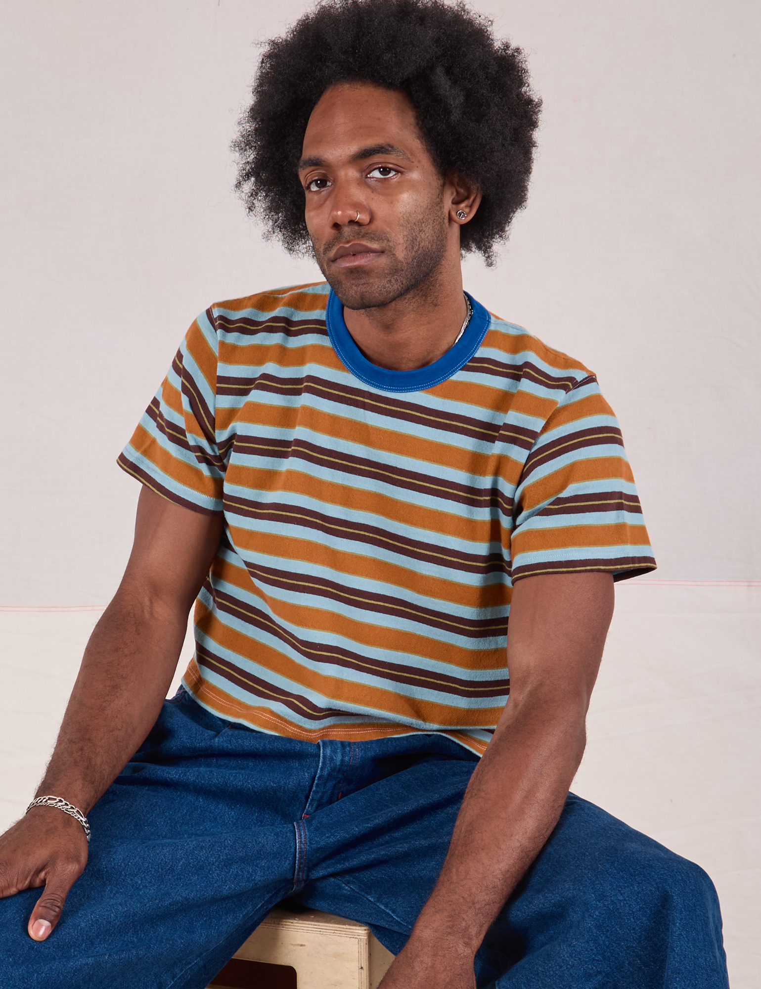 Jerrod is wearing Striped Crop Burly Tee in Baby Blue Overdye