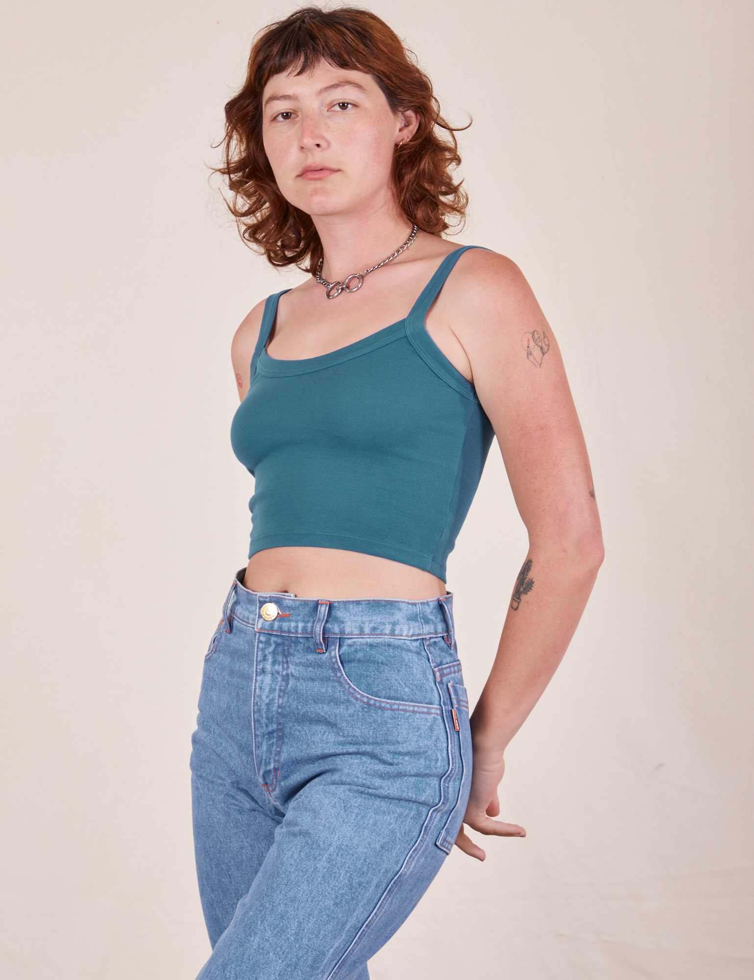 Alex is 5&#39;8&quot; and wearing P Cropped Cami in Marine Blue and light wash Frontier Jeans