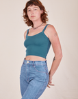 Alex is 5'8" and wearing P Cropped Cami in Marine Blue and light wash Frontier Jeans