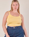 Lish is 5’8” and wearing M Cropped Cami in Butter Yellow paired with dark wash Carpenter Jeans