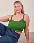 Lish is wearing Cropped Cami in Lawn Green and dark wash Carpenter Jeans