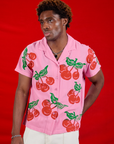 Isaac is 5'10" and wearing M Cherry Pantry Button-Up