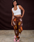 Kandia is 5'3" and wearing XS Gummy Bear Paintstamped Work Pants in Fudgesicle Brown paired with a Cropped Tank in Vintage Tee White