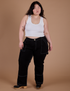 Ashley is 5’7” and wearing 1XL Carpenter Jeans in Black paired with a vintage tee white Cropped Tank