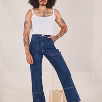 Jesse is 5'8" and wearing XS Carpenter Jeans in Dark Wash paired with a vintage off-white Cami