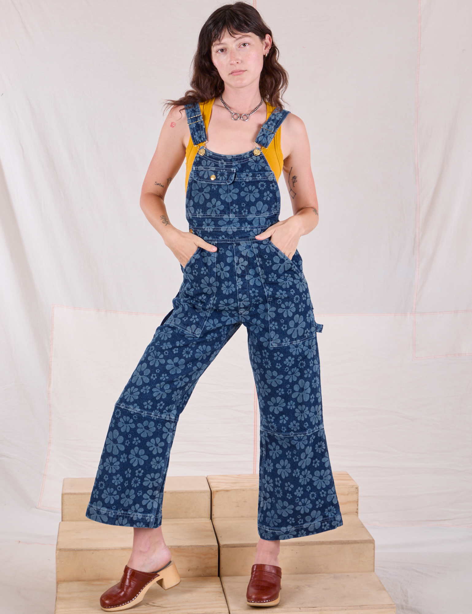 Alex is 5'8" and wearing XXS Carpenter Overalls in Lazy Daisy