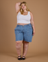 Juliet is 5'7" and wearing 2XL Carpenter Shorts in Medium Wash paired with a Cropped Tank in Vintage Tee White