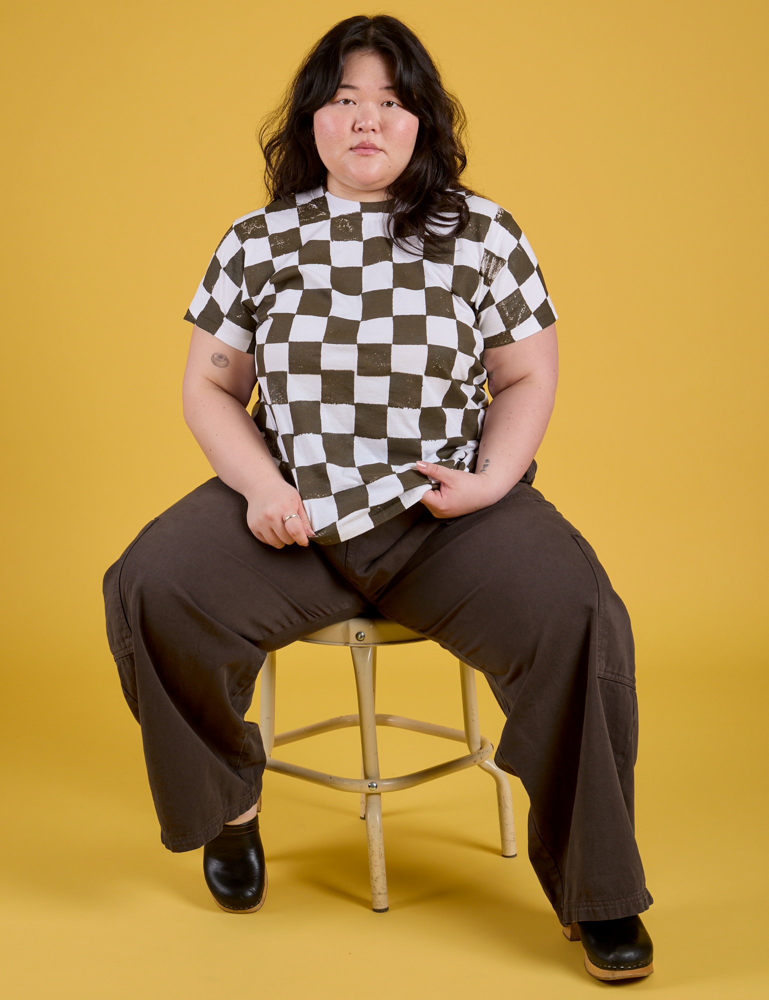 Ashely is wearing Checker Organic Tee in Espresso Brown