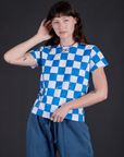 Alex is 5'8" and wearing P Checker Organic Tee in Blue