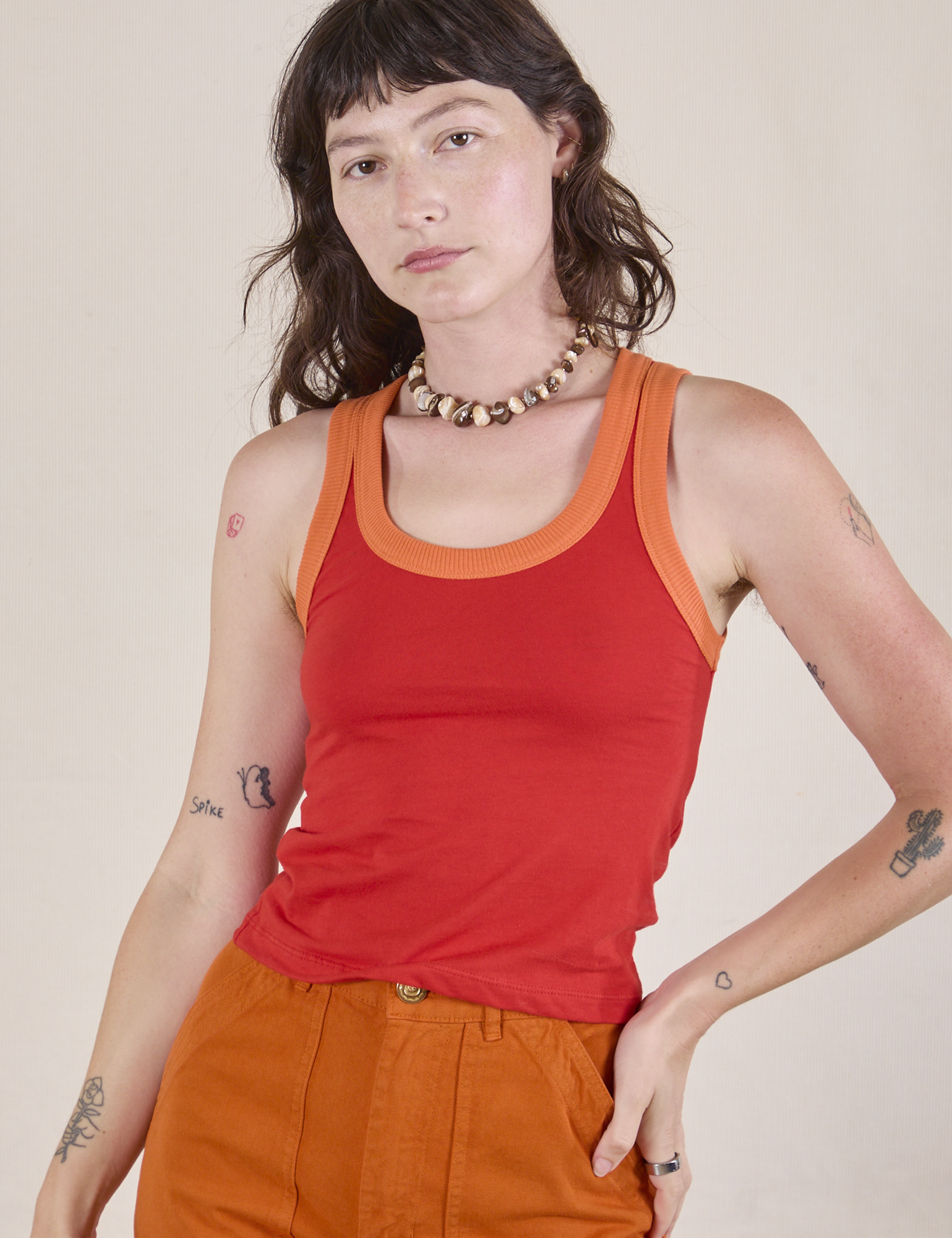 Alex is 5'8" and wearing P Colorblock Cropped Tank in Mustang Red