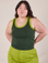Ashley is 5'7" and wearing L Colorblock Cropped Tank in Swamp Green