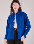 Alex is 5'8" and wearing P Cropped Overshirt in Royal Blue